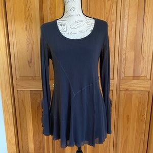 Loose fitting gray long top with flounce.